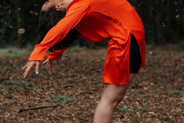 Yoga practitioners stretching gracefully outdoors, embracing nature.